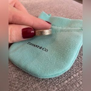 Ladies Tifffany Sterling ring with small diamond.